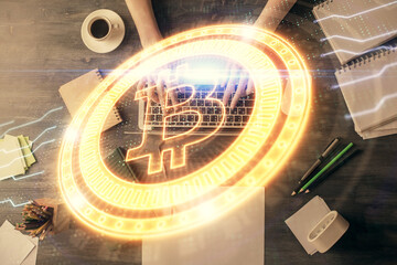 Double exposure of woman hands working on computer and blockchain theme hologram drawing. Top View. bitcoin cryptocurrency concept.