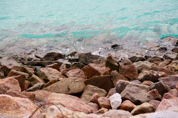A close up of a rock near the ocean