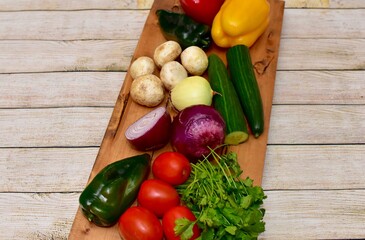 Fresh organic summer harvested vegetables washed and ready for preparing healthy meals and side dishes to share as a family