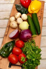 Fresh organic summer harvested vegetables washed and ready for preparing healthy meals and side dishes to share as a family