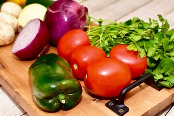Fresh organic summer harvested vegetables washed and ready for preparing healthy meals and side dishes to share as a family