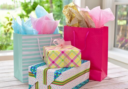 Specially wrapped gifts and bags for celebratory birthday party for special girl toddler 