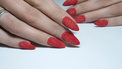 red long nail manicure on white background
