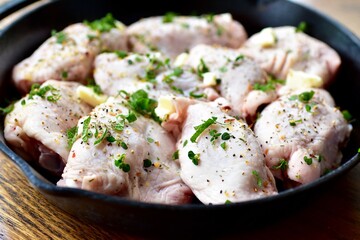 Preparing home made family recipe fried chicken with fresh organic herbs of thyme, sage, rosemary and butter for summer picnic outdoor dinner