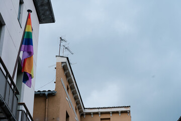 gay flag on the balcony of a town hall