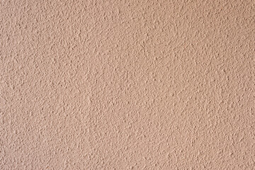 Abstract background texture on concrete wall. Surface of the wall covered with decorative plaster. Decorative interior wall cover 