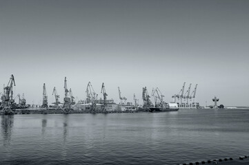Fototapeta premium Harbor cranes, black and white poster