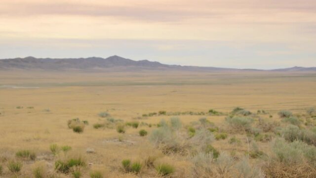 Desert 4k background plate for green screen and VFX, Medium Long Shot (MLS). Seamless loop, natural blur. Match with 50mm at f/10 on a full frame sensor, focus at 10ft.