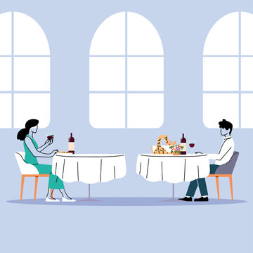 social distance in restaurant, a man and a woman sit a distance apart in separate tables with food
