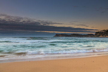 Sunrise seascape and low cloud bank