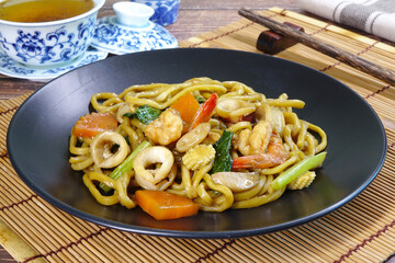 Stir fried noodle with seafood. Hokkian (Hakka) noodle, famous local food in Phuket Thailand