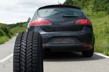 Fototapeta na wymiar Black car's new tyre
