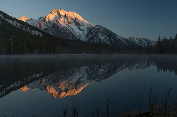Mt Moran reflected in Leigh Lake at sunrise;  Grand Teton NP;  Wyoming