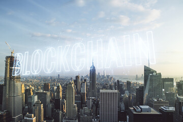 Abstract virtual blockchain technology hologram on New York city skyline background. digital money transfers and decentralization concept. Multiexposure