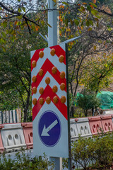 Direction and caution sign
