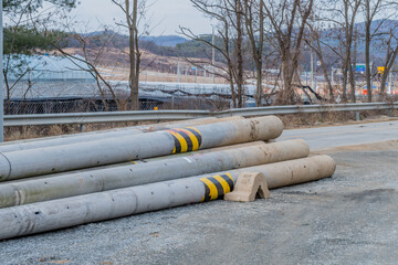 Utility poles laying on ground