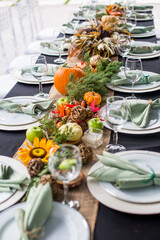 Formal Thanksgiving table and chavari chairs in the fall family group for holiday dinner