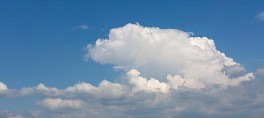 Naklejka na ściany i meble White clouds on blue sky background.