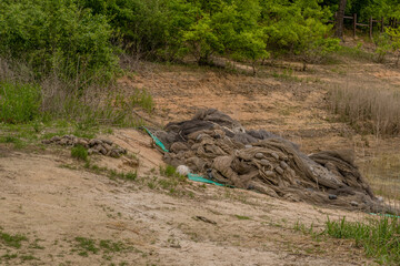 Fishing nets on riverbank.
