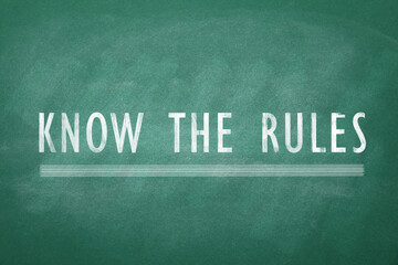 Phrase Know the rules on green chalkboard