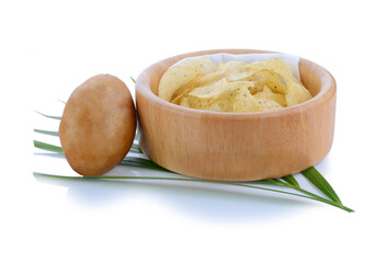 Homemade potato chips with sea salt and herb on wooden cutting board