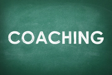 Obraz premium Adult learning. Word COACHING written on green chalkboard