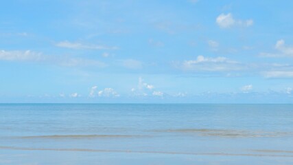Sky with clouds above the ocean, calm water surface