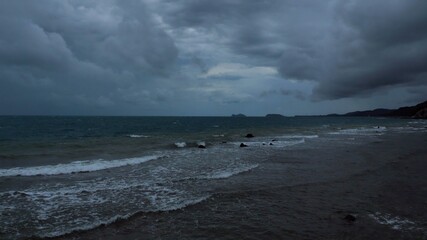 Rain storm sky with clouds moving  above the seascape