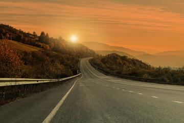 Road trip. Beautiful view of asphalt highway at sunset