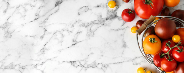 Flat lay composition with fresh tomatoes on marble table, space for text. Banner design