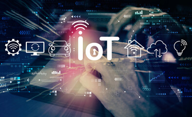 IoT theme with man using his tablet computer