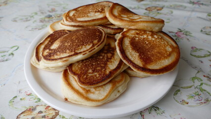 there are small pancakes on the platter