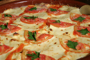 pizza with tomatoes and cheese