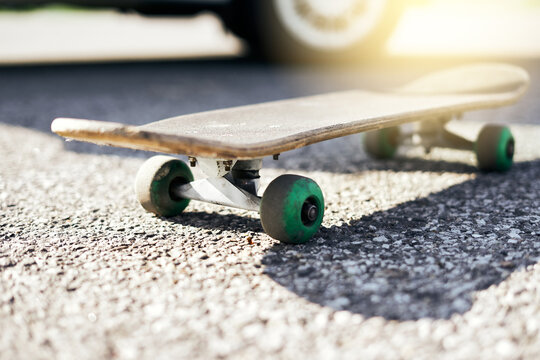 Blurred image out of focus  Skateboard on pavement, summer sport