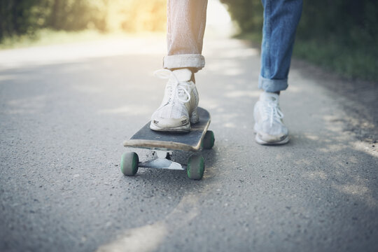 Blurred image skateboarding on road