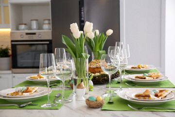 Festive Easter table setting with floral decor in kitchen