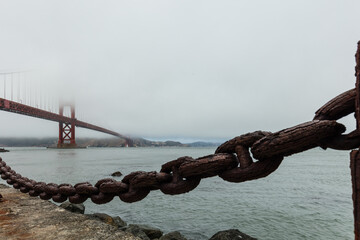 Rusty chain with the golden gate bridge in background