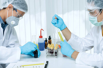 Researchers test blood samples and plasma in the laboratory. Researchers are inventing vaccines to...