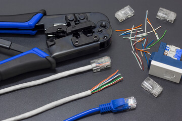 Lan cable crimpers, with Lan cable placed on the side and female socket head socket in a black...