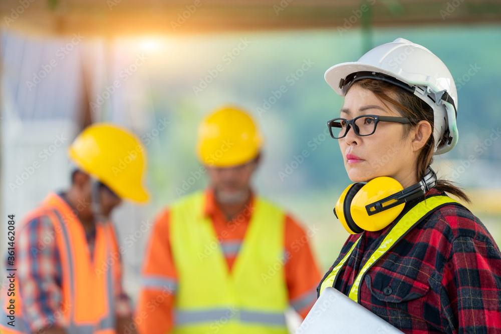 Poster team engineers and architect having working the inspection in construction site.