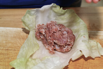 Preparing stuffed cabbage, Polish cuisine specialty.