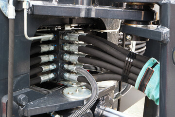 Power hydraulic control unit of the bucket of a modern excavator. Hydraulic rake.