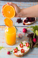 slice of bread with cream cheese and orange juice