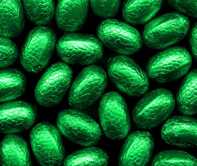 Closeup of foil wrapped chocolate easter eggs on a plain background