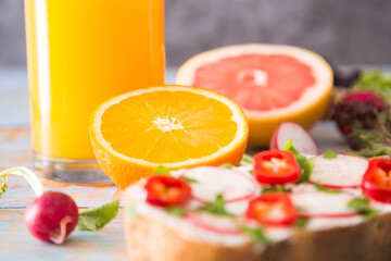 slice of bread with cream cheese and orange juice
