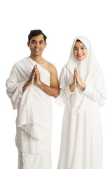muslim hajj man and woman smiling isolated over white background