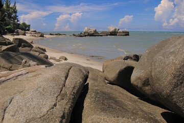 Obraz premium Panoramic beach with sand and stones on the island of Sand Bangka Belitung Indonesia