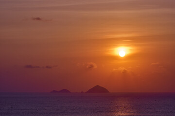 Naklejka na ściany i meble Spectacular sunrise over the tropical island. Calm seascape.