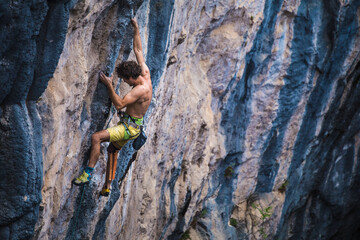 A strong man climbs a rock, Rock climbing in Turkey.