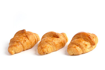 Fresh tasty croissants on white background. French pastry